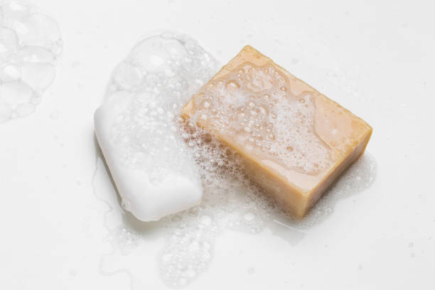 istock Soap bar and foam on white background, top view. Mockup for design 1289412653