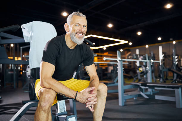 istock Pleased muscular coach smiling at the camera 1289415670
