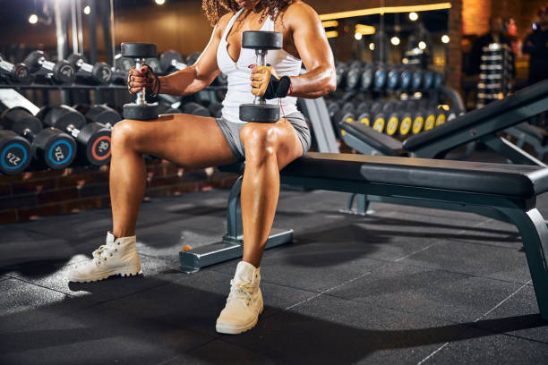 istock African American bodybuilder doing a seated dumbbell exercise 1289416104
