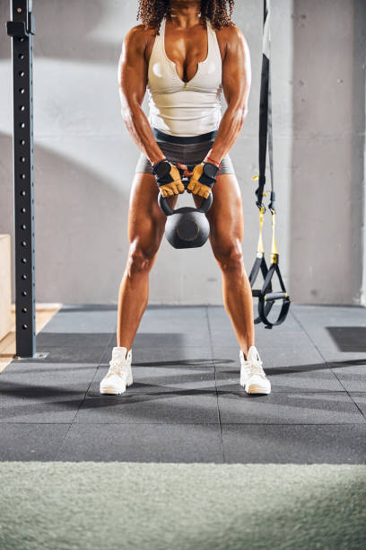istock Female bodybuilder working out at the gym 1289416150