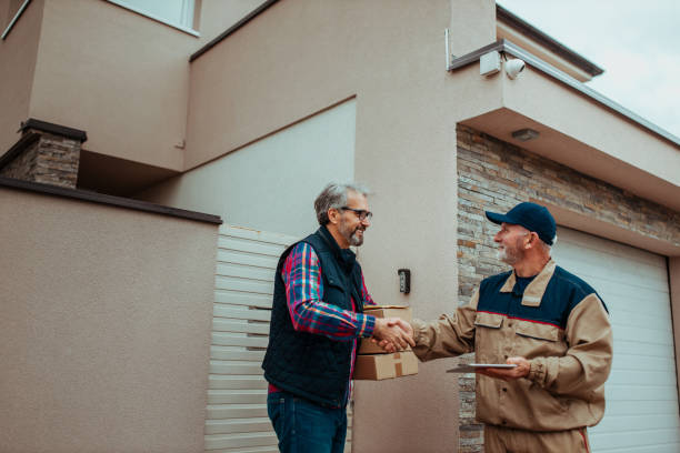 istock Postman delivered cardboard boxes to customer 1289416276