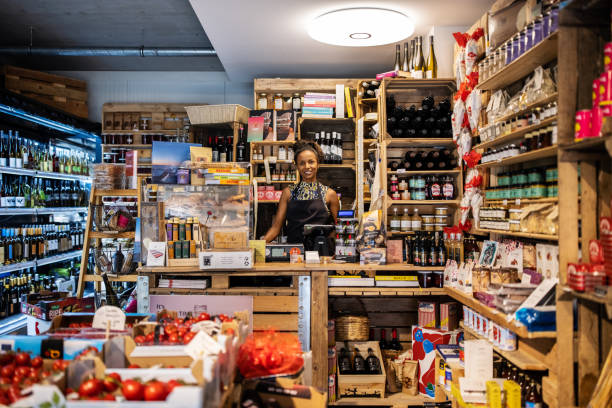 istock Smiling female cashier working in deli 1289416946