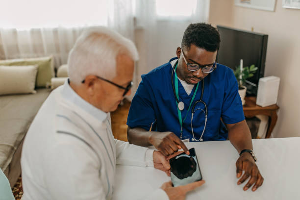 istock Doctor explaining tele medicine to a patient 1289421956
