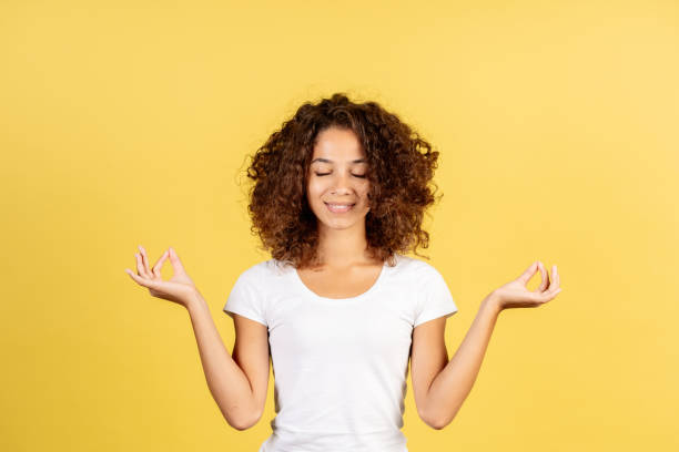 istock Young afro american woman on yellow copy space background 1289422238