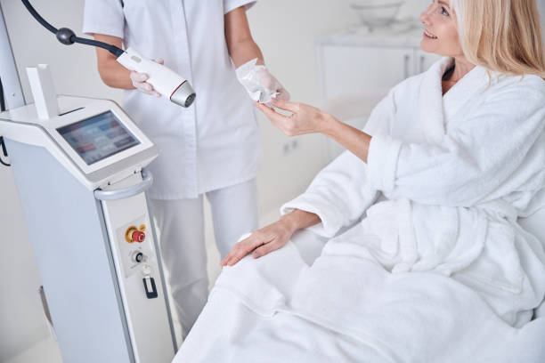 istock Happy smiling patient spending time in beauty cabinet 1289422412