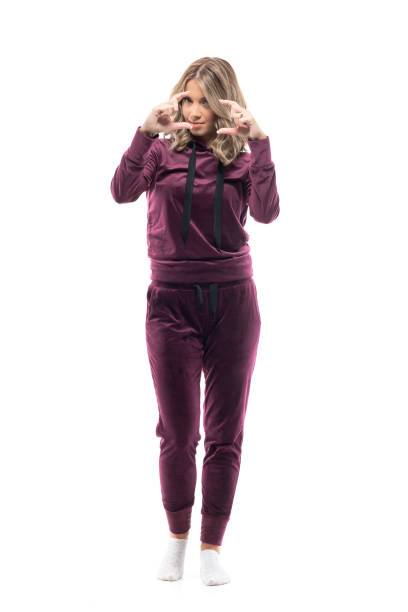 istock Cute lovely female painter artist in cozy clothes using finger frame for composition. 1289422757