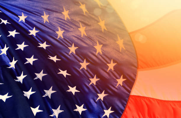 istock Close up American flag and glowing light 1289424144
