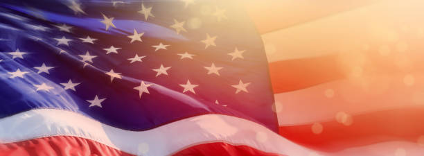 istock Close up American flag and glowing light 1289424146