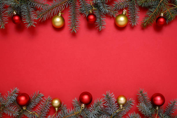 istock Christmas decorations and fir tree on red background 1289426788
