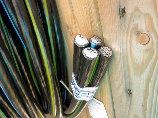 istock Electric power copper cable in black insulation on a wooden coil 1289428802