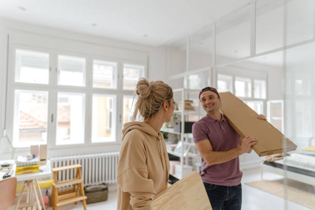 istock Young couple moving into a new apartment 1289429612