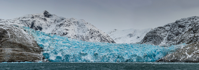 Antarctic iceberg landscape in Cierva Cove - a deep inlet on the west side of the Antarctic Peninsula, surrounded by rugged mountains and dramatic glacier fronts.