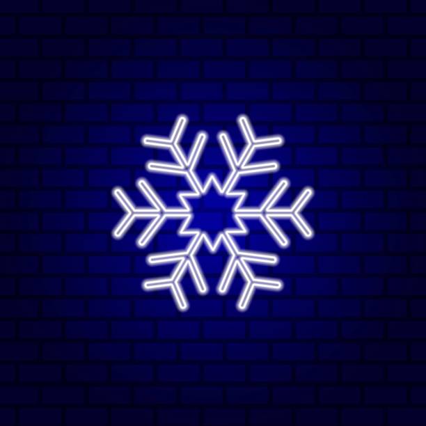 istock White snowflake neon sign. Luminous signboard with ice crystal. Vector illustration in neon style on the wall background. 1289430158