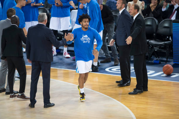 istock Basketball coaches cheering their player 1289431208