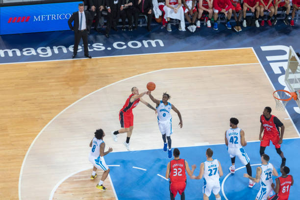 istock Basketball players chasing for ball 1289431228