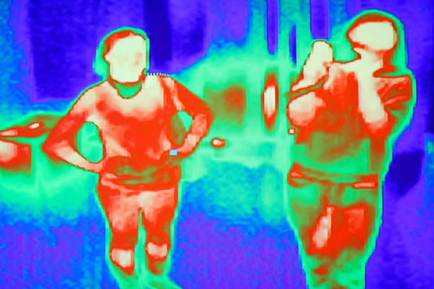 istock Thermal scanner camera detecting infected people with Covid 19. Modern airport checking system 1289432481