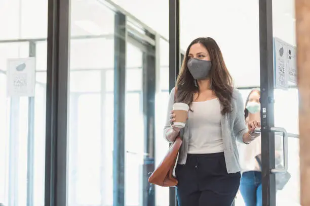 Photo of Businesswomen return to office during COVID-19 pandemic