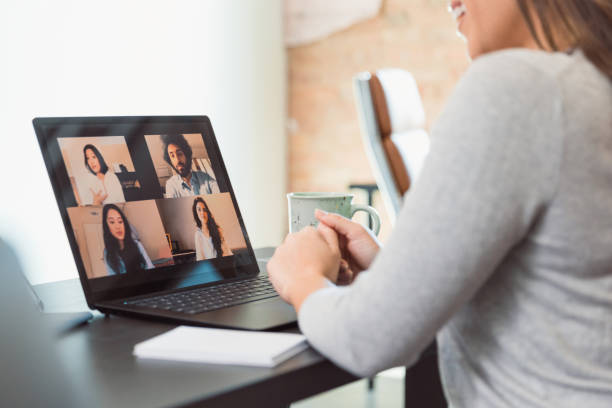 istock Unrecognizable woman has virtual meeting with diverse colleagues 1289433262
