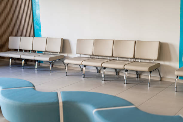 istock Lobby or waiting hall in an airport. Raw with leather light chairs. Selective focus. 1289433590