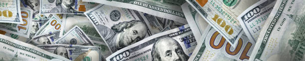 prosperity concept of large group of dollar bills Conceptual business and finance image of large group of American one hundred dollar bills super money stock pictures, royalty-free photos & images