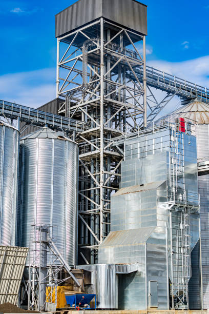 istock Wireframe in the plant. Steel construction near grain elevators. Selective focus from below. 1289436965