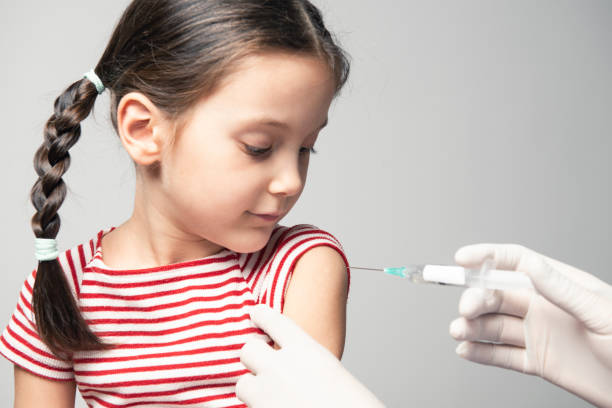 istock Girl With Vaccination 1289437842