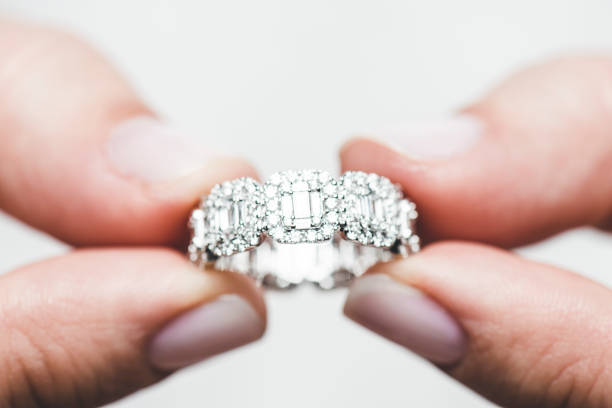 Various jewelry and a ring with a decorative stone. Luxury items.