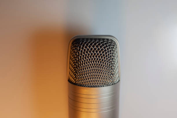 Microphone for voice recording. Sound recording device in artificial lighting.
