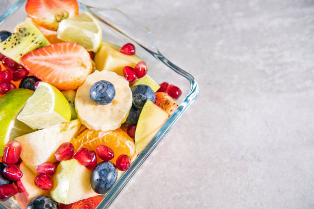 istock Portion fruit salad in a bowl . Healthy meal 1289439587