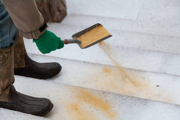 istock Hand sprinkles slippery steps with dry sand 1289439666