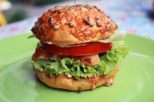 istock Tasty classical burger with meat, lettuce and tomato 1289440489