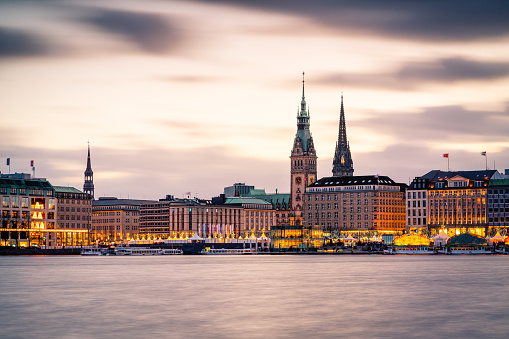 Hamburg town hall and Alster Lake with Christmas market.