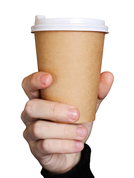 istock Man holding a paper coffee cup on white background 1289441834