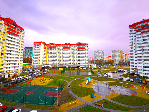 Courtyard of a multi-storey residential building with a playground in autumn in Krasnodar Russia