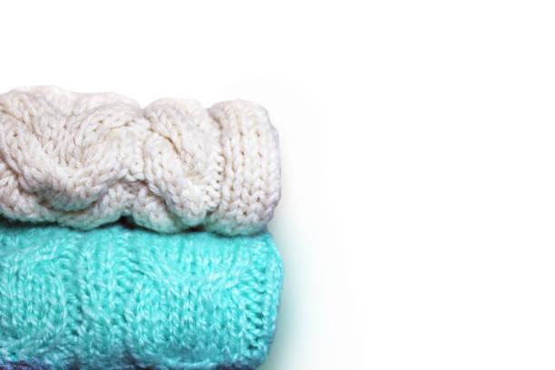istock White and turquoise knitted textile on white background 1289442876