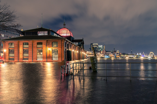 The Hamburg fish market and its promenade is under water at high tide.