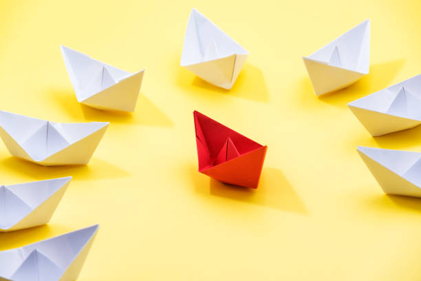 istock Leadership Concept With Paper Boats 1289447416