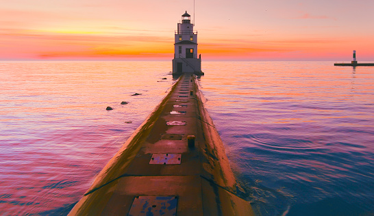 Amazing predawn beauty of a lighthouse greeting the dawn over Lake Michigan.