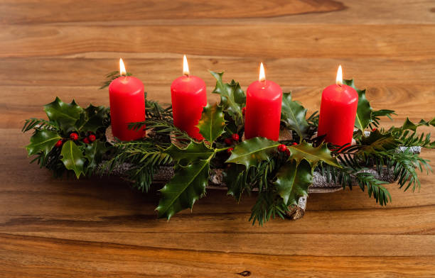 istock Handmade advent candles stick holder made from natural eco materials. DIY, sustainable Christmas, zero waste, plastic free, eco friendly gift and home decor. Lighting fourth candle of Advent 1289453794