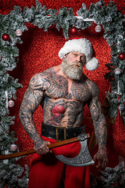 istock Bad Ass Bearded tattooed Santa Claus 1289453903