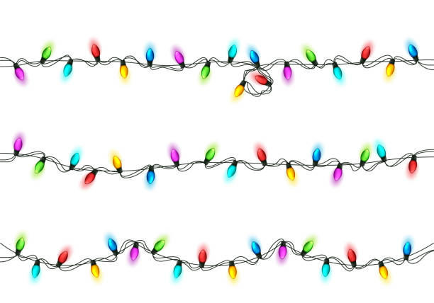istock Christmas Festive Lights. Decorative Glowing Garland Isolated on White Background. Shiny Colorful Decoration for Christmas and New Year Holidays 1289456032