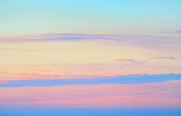 istock Clear blue sky with glowing pink and yellow cirrus clouds after storm at sunset. Dramatic cloudscape. Concept art, meteorology, heaven, hope, peace, graphic resources, picturesque panoramic scenery 1289456946