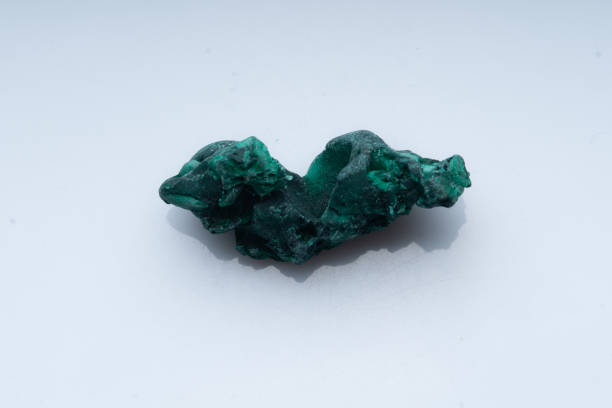 istock Malachite green ore on a white background. Natural green malachite 1289457034
