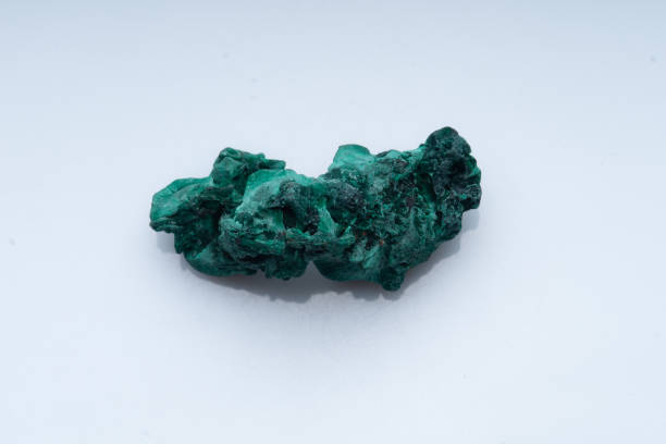 istock Malachite green ore on a white background. Natural green malachite 1289457043