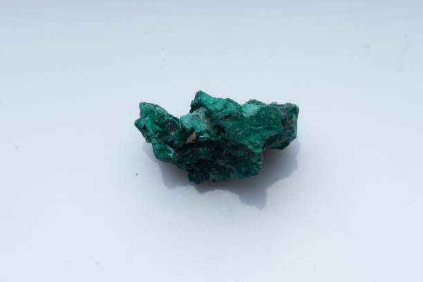 istock Malachite green ore on a white background. Natural green malachite 1289457046