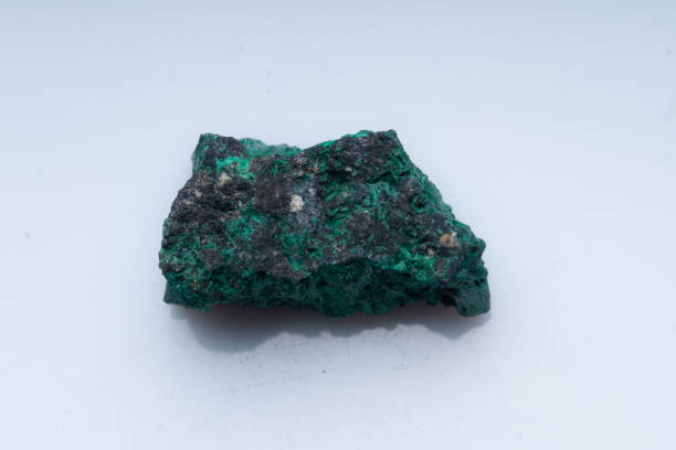 istock Malachite green ore on a white background. Natural green malachite 1289457068