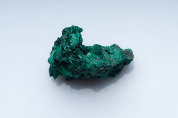 istock Malachite green ore on a white background. Natural green malachite 1289457080