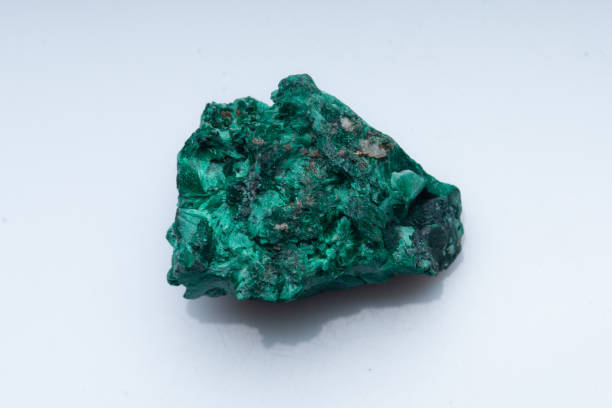 istock Malachite green ore on a white background. Natural green malachite 1289457083