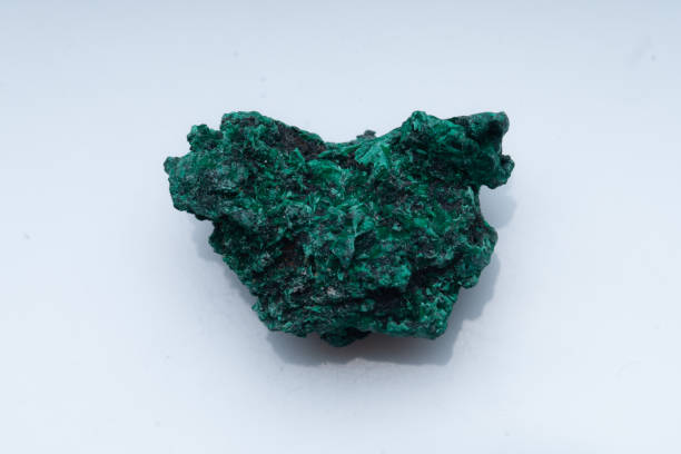 istock Malachite green ore on a white background. Natural green malachite 1289457107