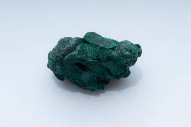 istock Malachite green ore on a white background. Natural green malachite 1289457172